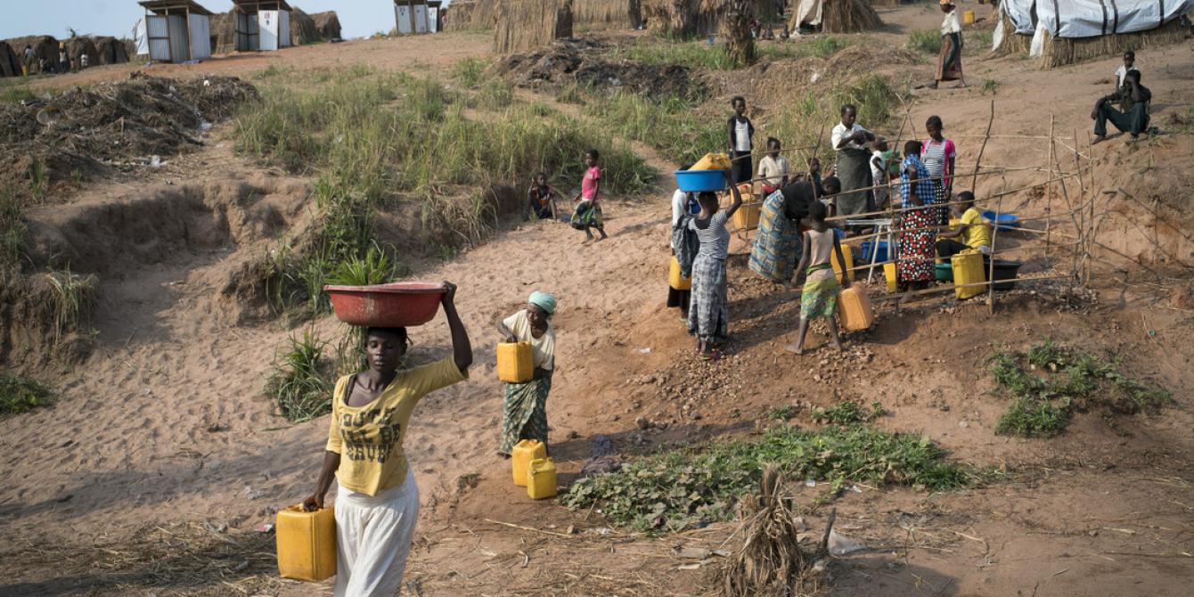 Women collecting water from a tap stand in Kalunga in DRC. Photo by Diana Zeyneb Alhindawi/Oxfam Women collecting water from a tap stand in Kalunga in DRC. Photo by Diana Zeyneb Alhindawi/Oxfam