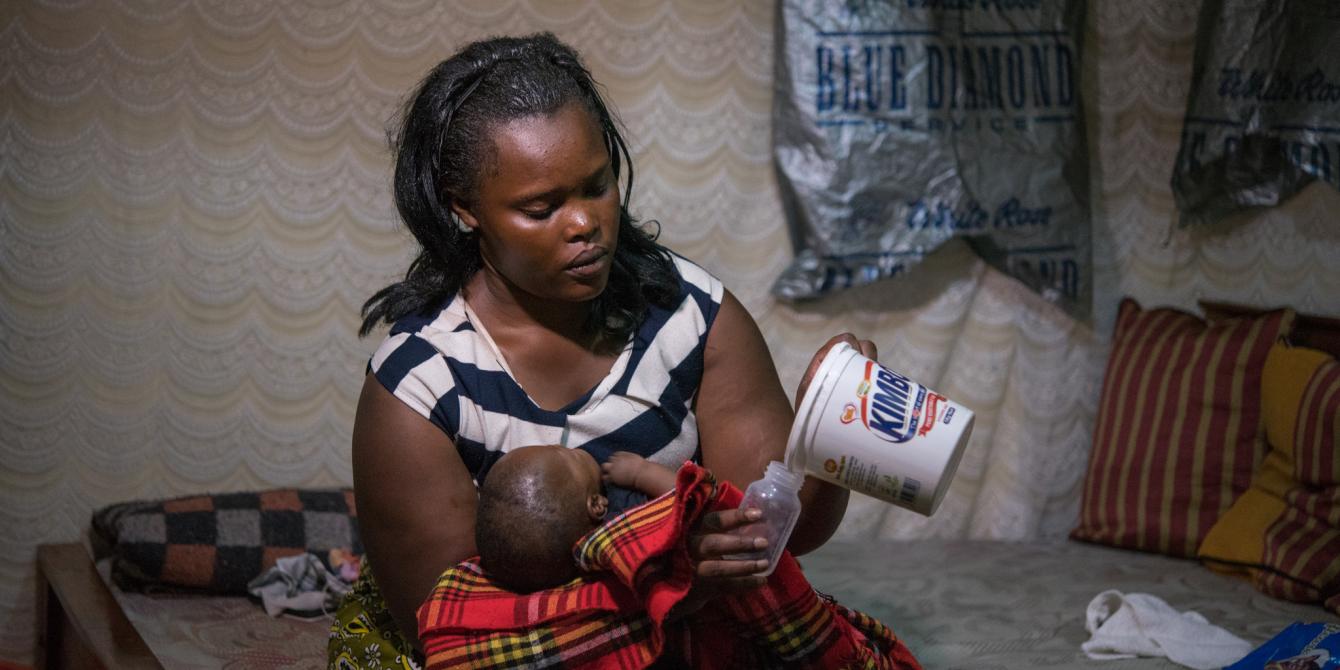 Elizabeth Wayua,31, a domestic worker feeds the baby of her employer in Pipeline, Embakasi, Nairobi, Kenya. 2016. Photo Credit/Allan Gichigi Elizabeth Wayua,31, a domestic worker feeds the baby of her employer in Pipeline, Embakasi, Nairobi, Kenya. 2016. Photo Credit/Allan Gichigi