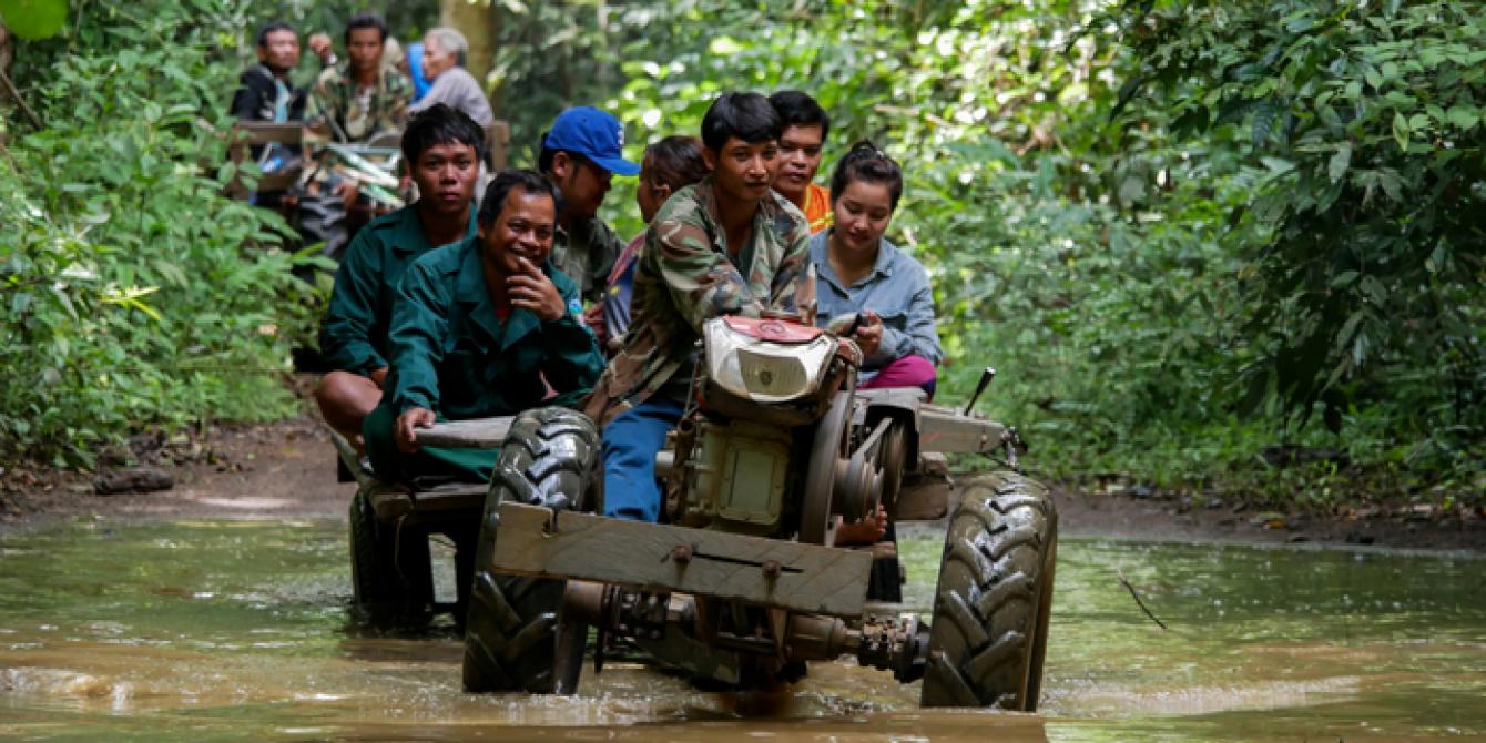 People Protecting Their Ecosystem in the Lower Mekong a tractor crossing river