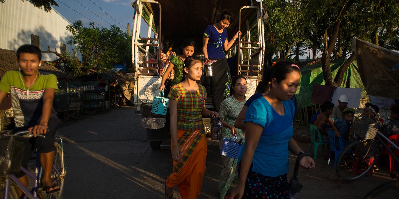 Women workers in garment industry, Photo by: Kaung Htet/ Oxfam Women garment workers in Hlaing Thar Yar Industrial Zon, are going back to home from work by factory's ferry. Photo by: Kaung Htet/ Oxfam