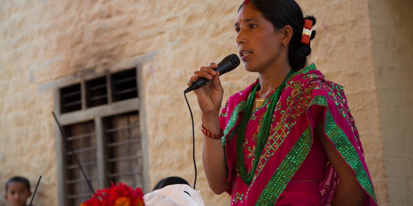 Janaki Oli (28) performs as the master of ceremonies at an event organised by the seed production group in Satmule, Surkhet, Nepal to celebrate International Women's Day - Credit: Aubrey Wade/Oxfam Janaki Oli (28) performs as the master of ceremonies at an event organised by the seed production group in Satmule, Surkhet, Nepal to celebrate International Women's Day - Credit: Aubrey Wade/Oxfam
