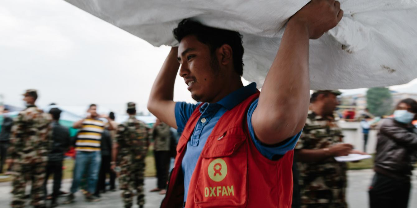 Oxfam volunteer Shekhar Khadka (23) works to off load latrines being delivered to the Tundikhel IDP camp in Kathmandu, Nepal. He is one of 500 volunteers trained to react in the event of an earthquake during the urban risk management program - Credit: Aubrey Wade/Oxfam Oxfam volunteer Shekhar Khadka (23) works to off load latrines being delivered to the Tundikhel IDP camp in Kathmandu, Nepal. He is one of 500 volunteers trained to react in the event of an earthquake during the urban risk management program - Credit: Aubrey Wade/Oxfam