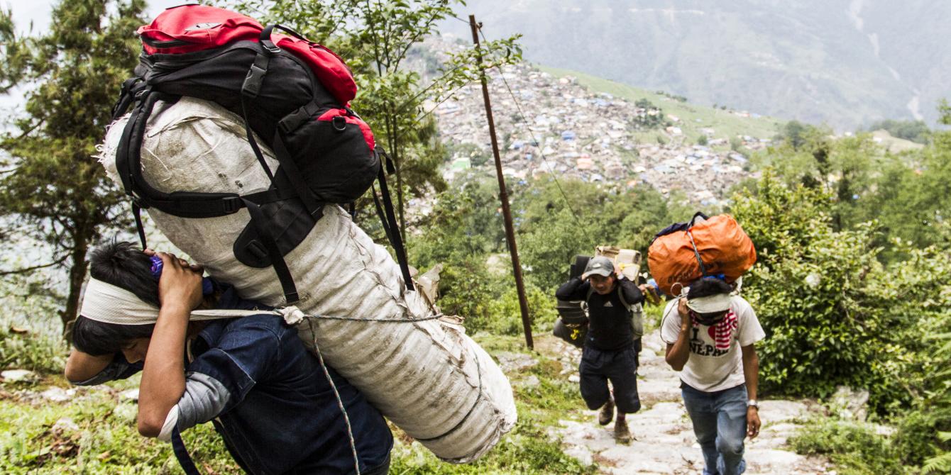 Porters carry relief goods up to remote Laprak village in Gorkha district - Credit: Sam Pickett/Oxfam Porters carry relief goods up to remote Laprak village in Gorkha district - Credit: Sam Pickett/Oxfam