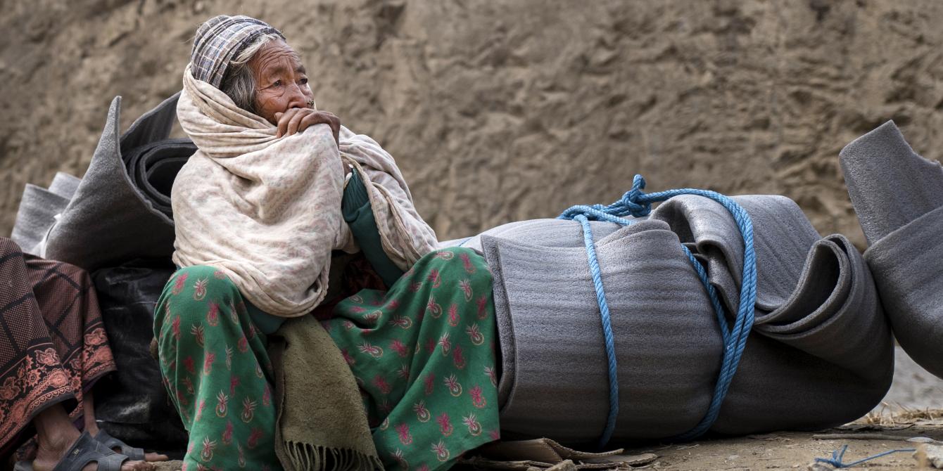 Elderly earthquake survivor waits for transport after receiving a Winterization Kit - Credit: Kieran Doherty/Oxfam Elderly earthquake survivor waits for transport after receiving a Winterization Kit - Credit: Kieran Doherty/Oxfam