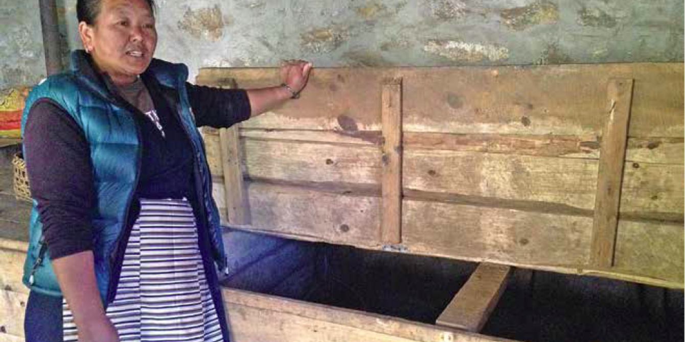 Furafutti Sherpa showing the wooden boxes which were earlier safe to store the potatoes she harvested Furafutti Sherpa showing the wooden boxes which were earlier safe to store the potatoes she harvested