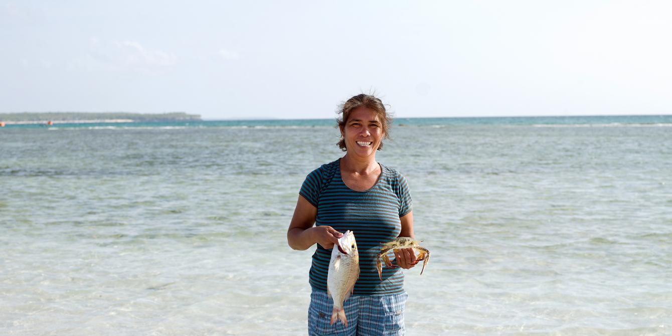 Fish Saleswoman Imelda Esgana from Santa Fe, Bantayan Island earns her main income selling fish. However, after typhoon Haiyan swept her island town, there were no more fish to sell, and even her boat was destroyed. But thanks to Oxfam's boat repair project, she is slowly getting back her livelihood. (Photo: Tessa Bunney/Oxfam) Fish Saleswoman Imelda Esgana from Santa Fe, Bantayan Island earns her main income selling fish. However, after typhoon Haiyan swept her island town, there were no more fish to sell, and even her boat was destroyed. But thanks to Oxfam's boat repair project, she is slowly getting back her livelihood. (Photo: Tessa Bunney/Oxfam)