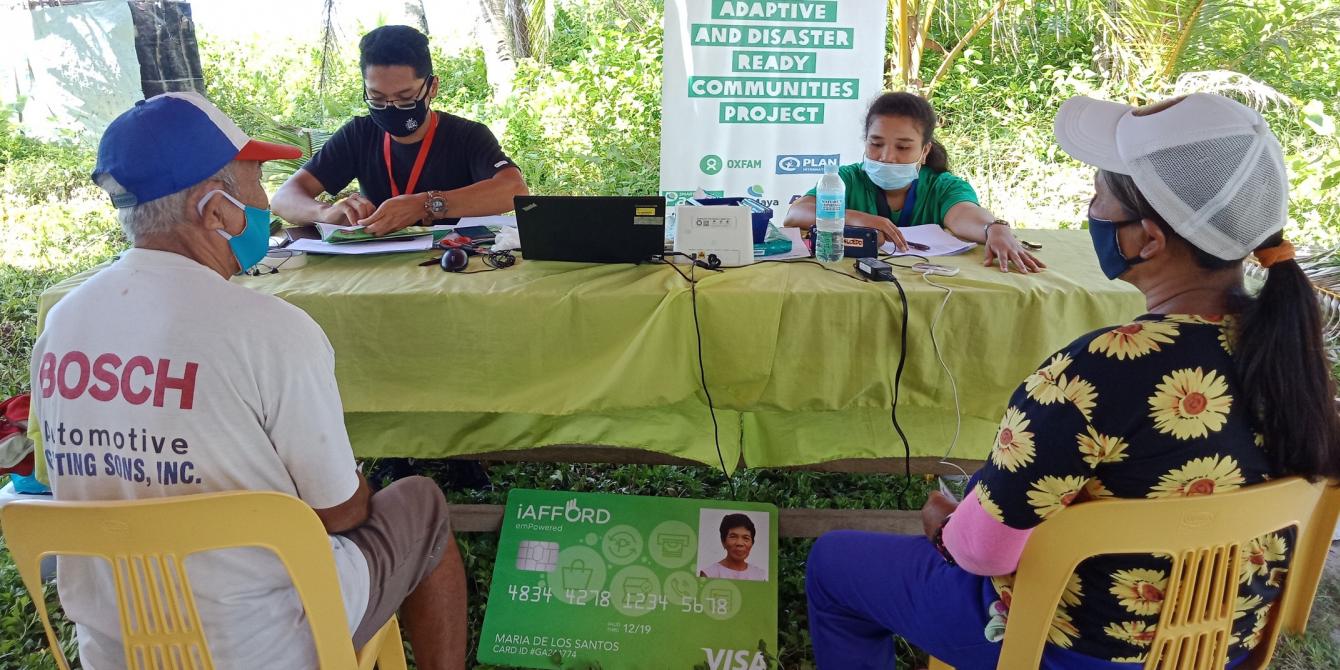 Distribution of iAFFORD Cards to project participants in Barangay Burak, one of the priority areas of the B-READY Project. (Photo: PDRRN)