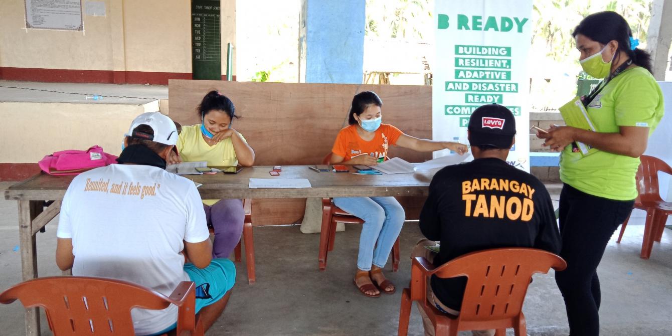 Distribution of iAFFORD Cards to project participants in Barangay Matarinao, one of the priority areas of the B-READY Project. (Photo: PDRRN)